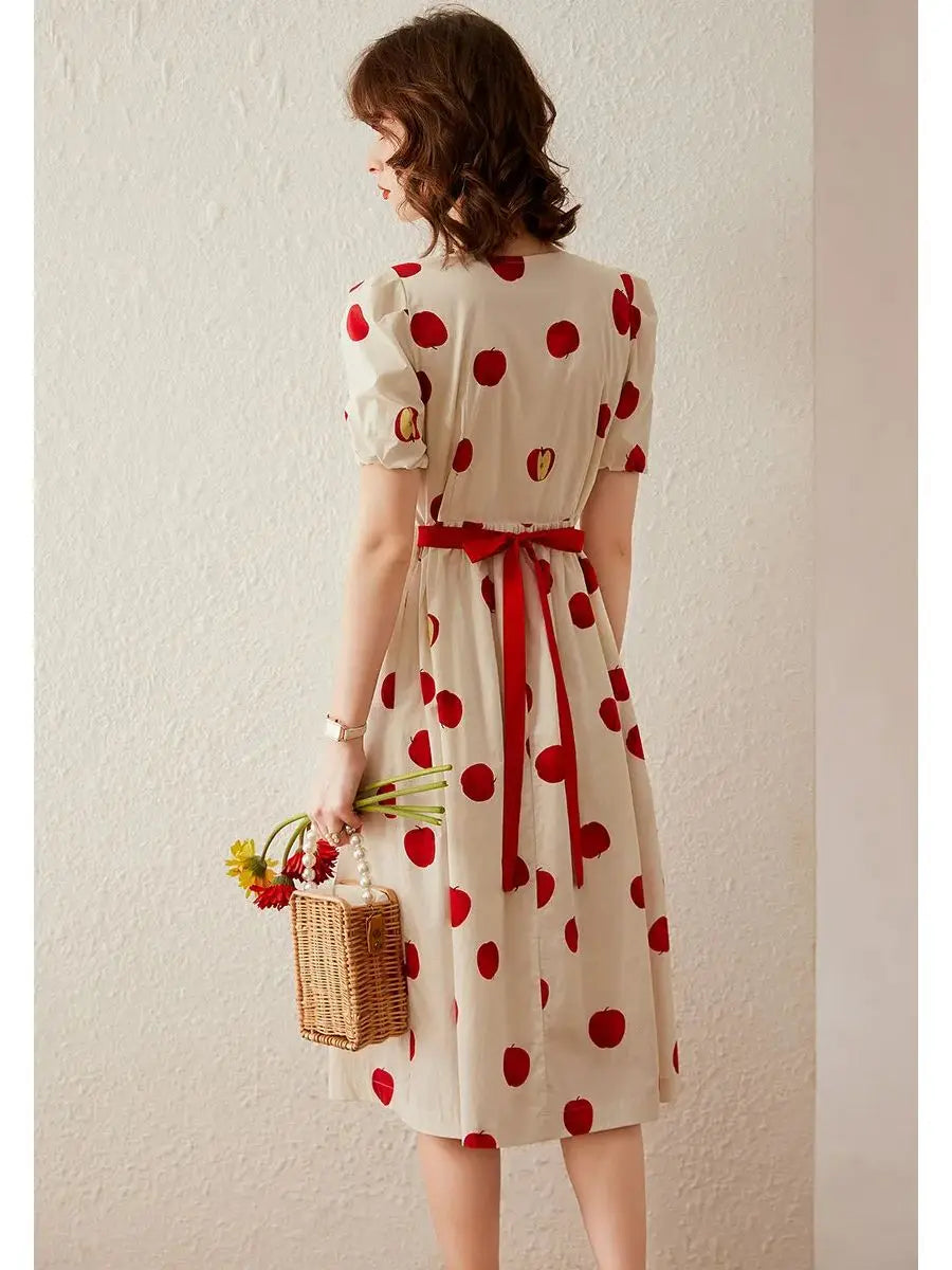 Vestido largo con cuello redondo, manga corta, cintura alta y mangas abullonadas con estampado elegante de manzana